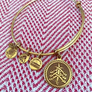 Alex and Ani 7 Swords bracelet in gold tone.
